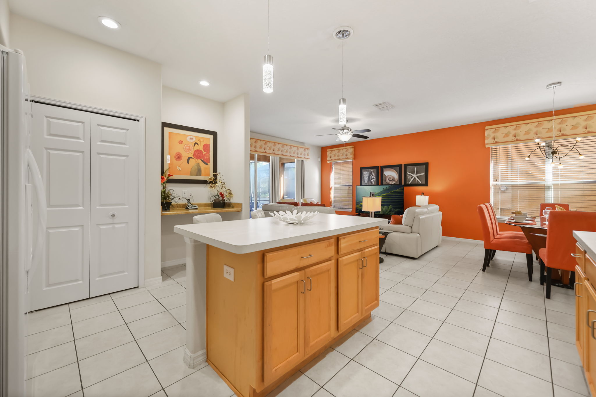 Kitchen island opening to the living and dining areas